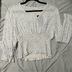 White and blue floral blouse